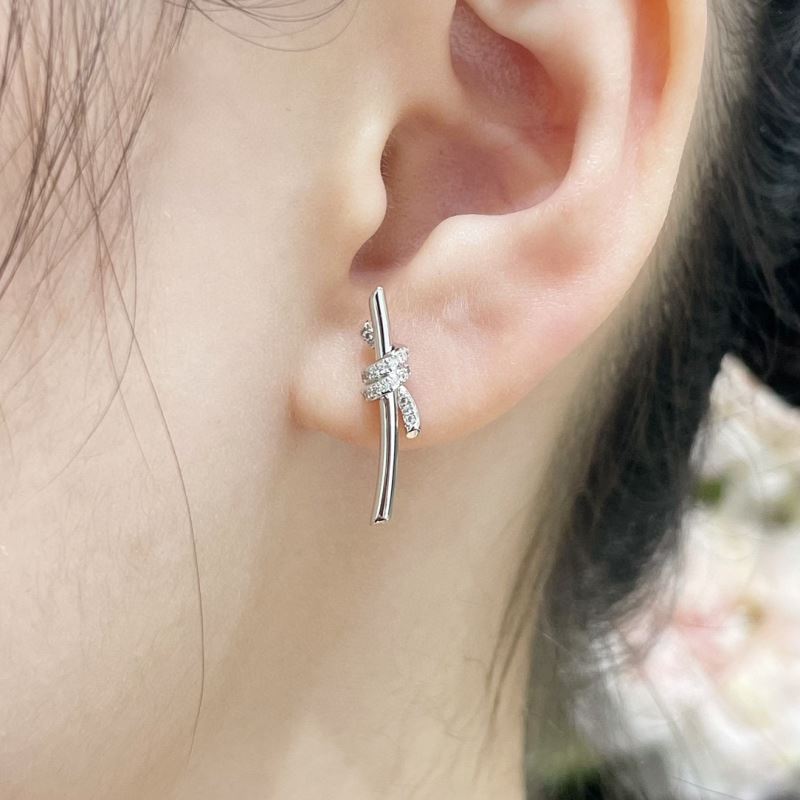 T*f*ny earrings
